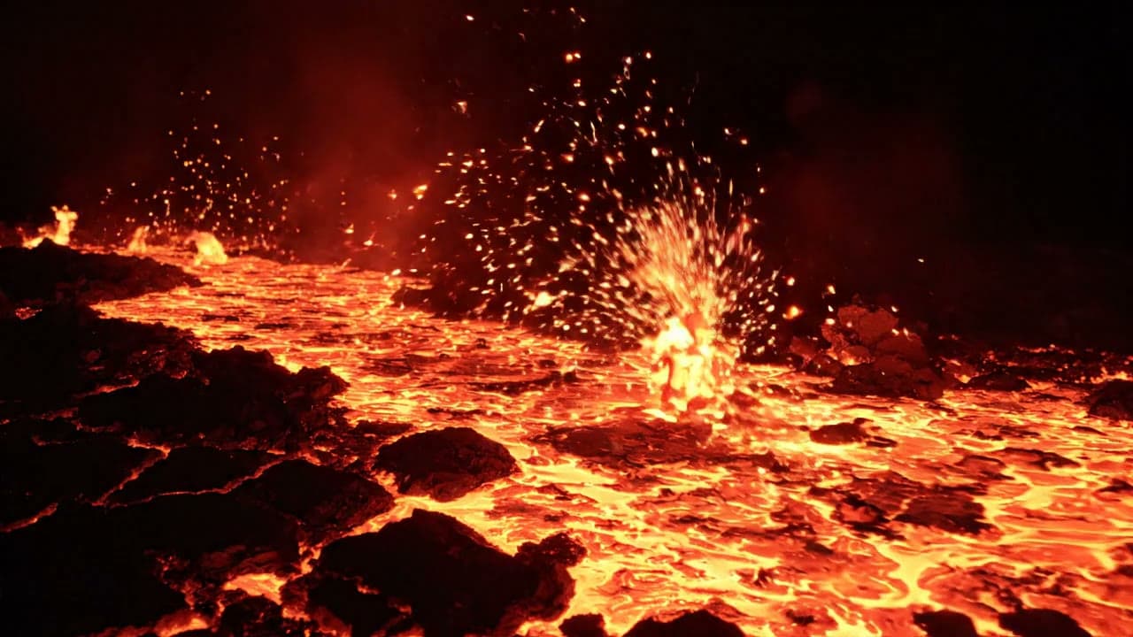 Glowing Magma River Flowing Through Rock at Night