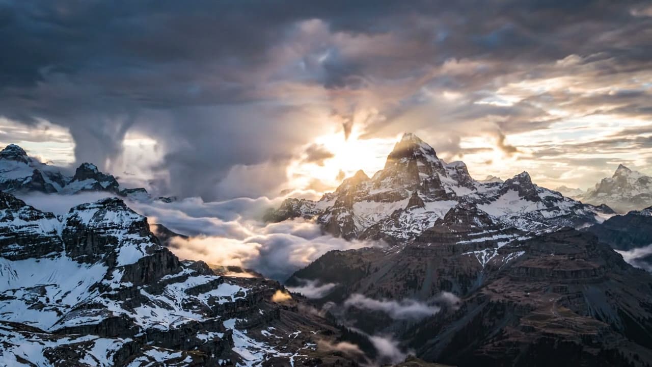Dramatic Clouds Flowing Over Mountain Peaks